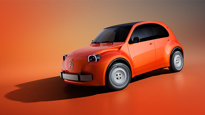 Foto de estúdio de Citroen 2CV elétrico vermelho em fundo avermelhado