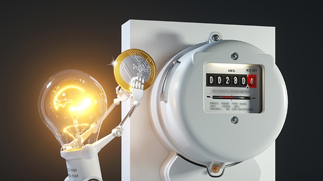 Boneco com cabeça de lâmpada a colocar uma moeda num contador de eletricidade