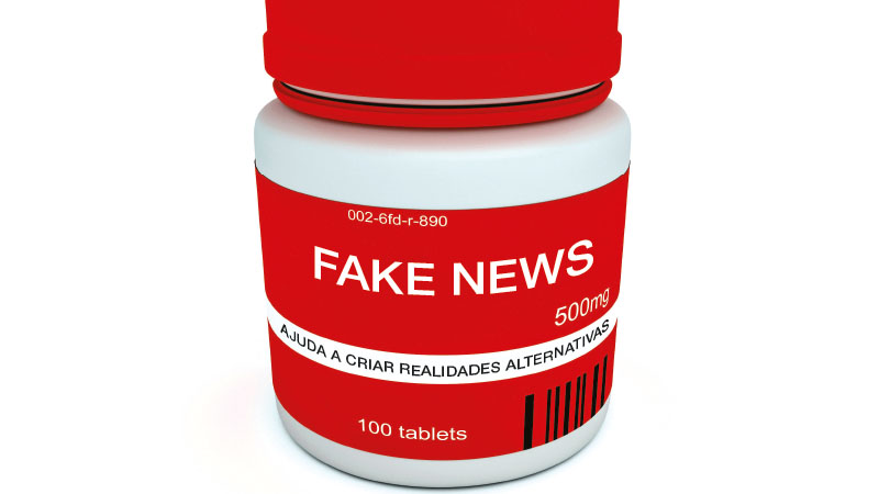 frasco de medicamentos com rótulo a indicar fake news